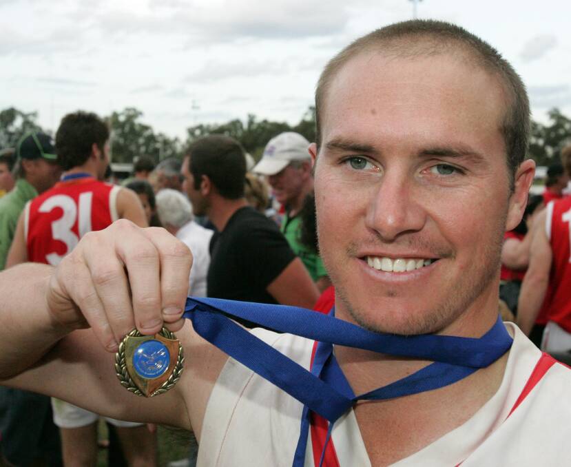 Brad Aiken with a Nitschke Schmidt Medal as best on ground in Collingullie's 2008 grand final win. He also won four Gerald Clear medals in the Farrer League and six premierships. 
