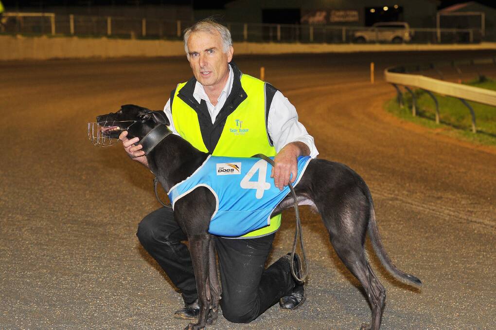 Greyhound trainer Peter Dooner with one of his previous winners at Wagga. 