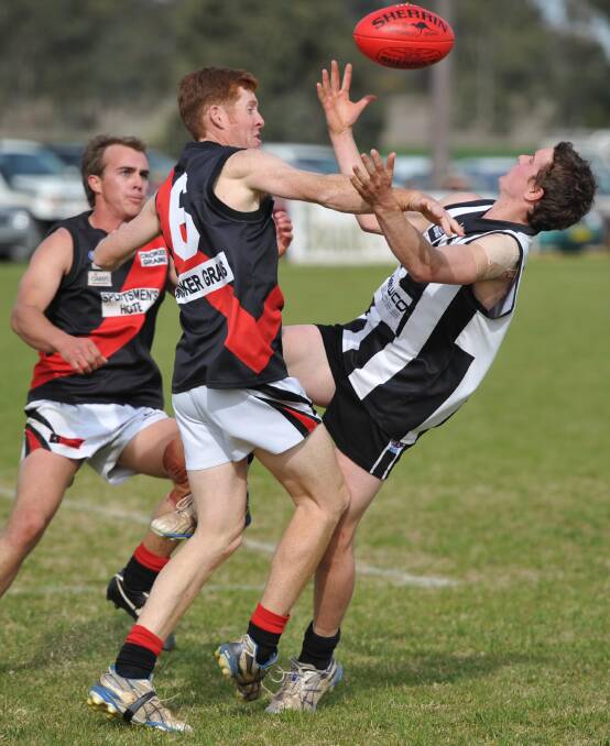 Marrar's Ben Langtry (6) spoils Todd Hannam (TRYC) in the 2011 grand final loss to the Magpies. Langtry will play his 250th club game in Sunday's reserve grade semi-final against TRYC. Mitch Taylor (background) brought up 250 games for the Bombers earlier this season. 