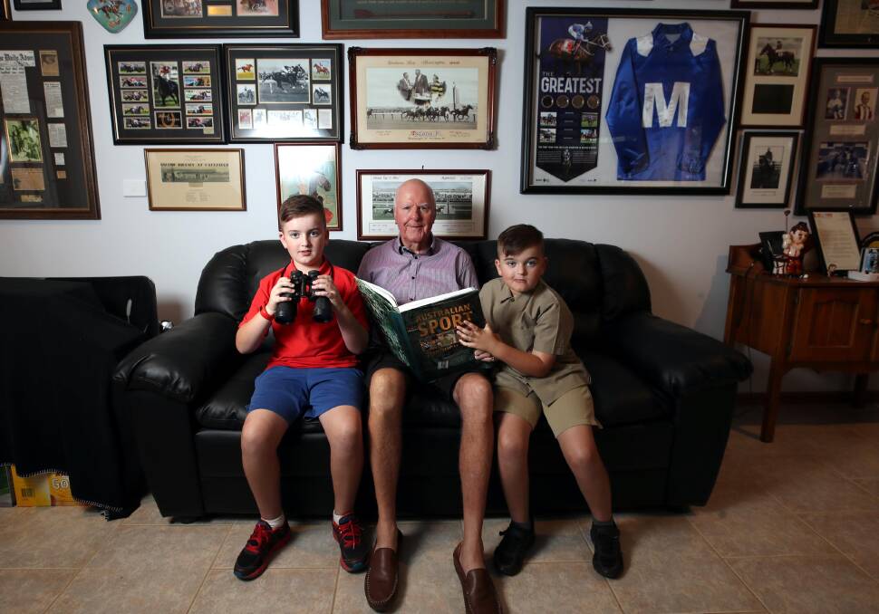 BIG FAN: Terry Ahern with grandsons Jack (left) and Cooper Gowland in front of some of his Winx racing memorabilia. Picture: Les Smith