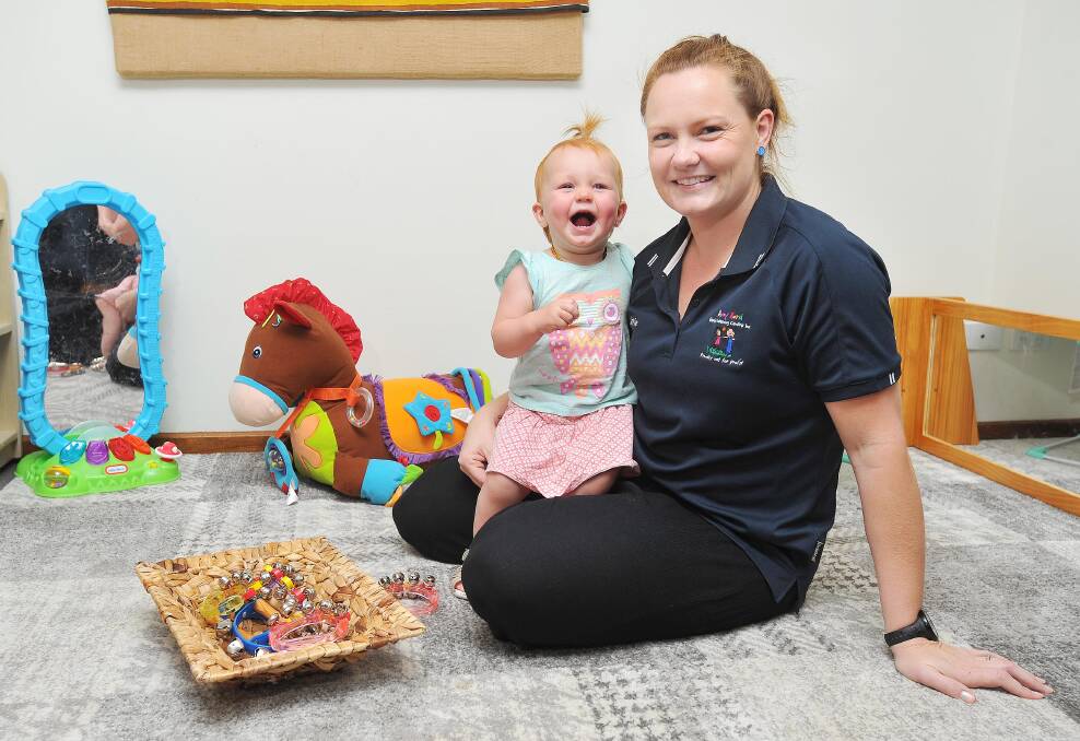 ALL SMILES: Matilda Howard, 14 months, and mum Katie Howard have a jam with some bells. Picture: Kieren L Tilly
