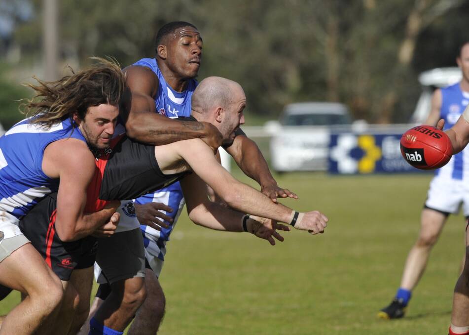 TACKLE: Marrar's Bryce Graetz releases the ball before Temora's Jackson Wheeler (left) and Billy Mallard tackle him on Saturday. Picture: Les Smith. 