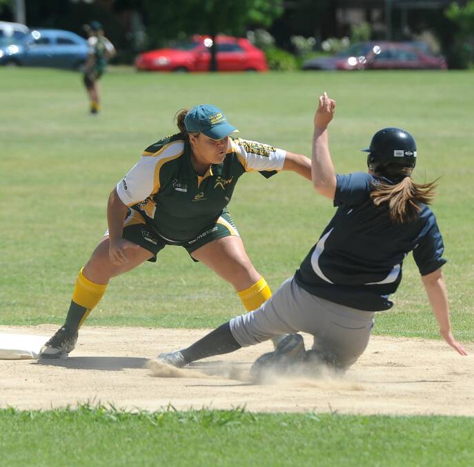 OVER AND OUT: South Wagga Warriors' fielder Montana Kearnes taps Saints' Michelle Tabisz in the A Grade softball on Saturday. Picture: Laura Hardwick