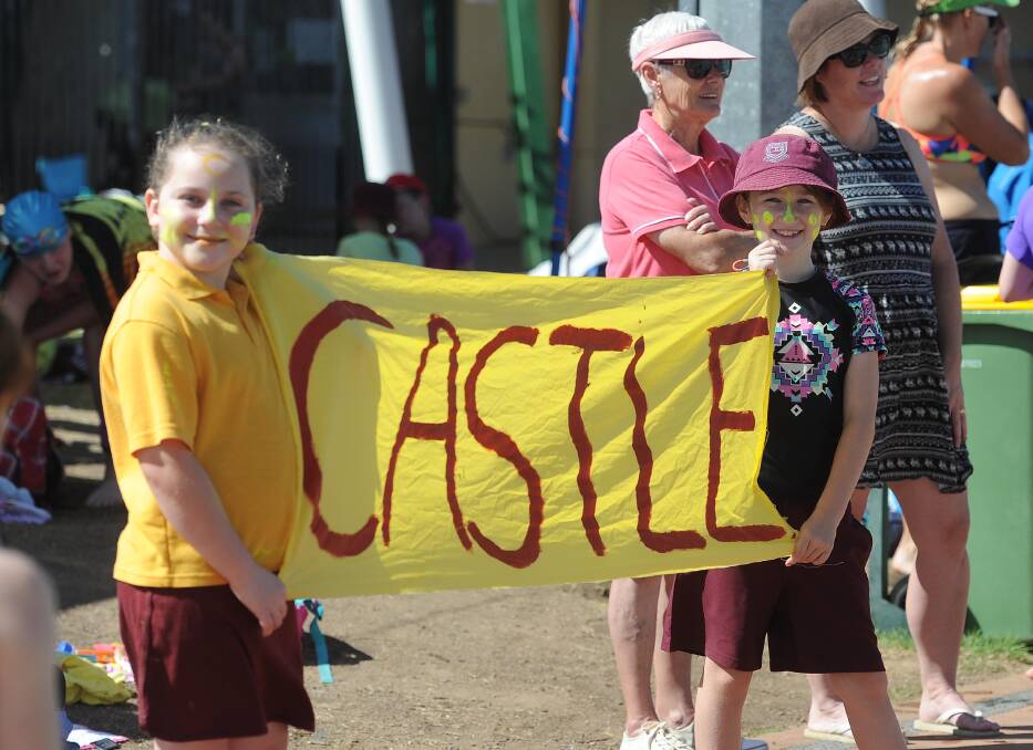 SPORTSMANSHIP: Kate Burton, 9, and Caitlyn Griffon, 9, cheering on buddies at Kooringal Public School Swimming Carnival at Oasis on Tuesday. Picture: Laura Hardwick