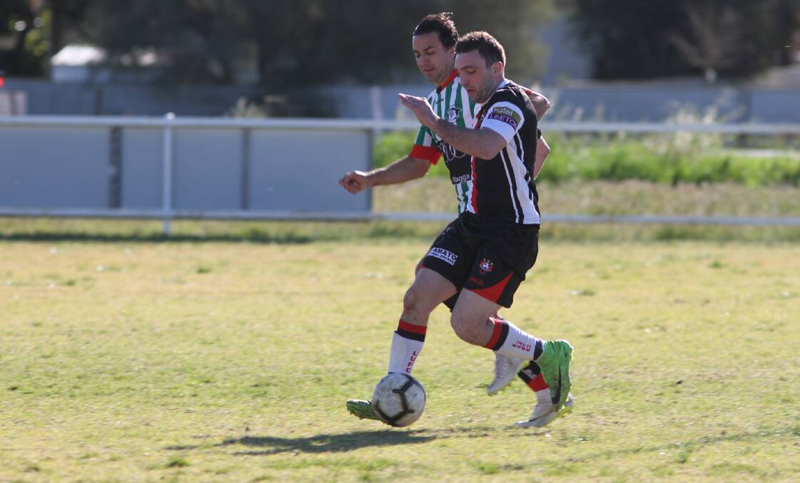 ON HOLD: Leeton United's Adam Raso looks to maintain possession during a game in the Football Wagga competition last season. Picture: Talia Pattison