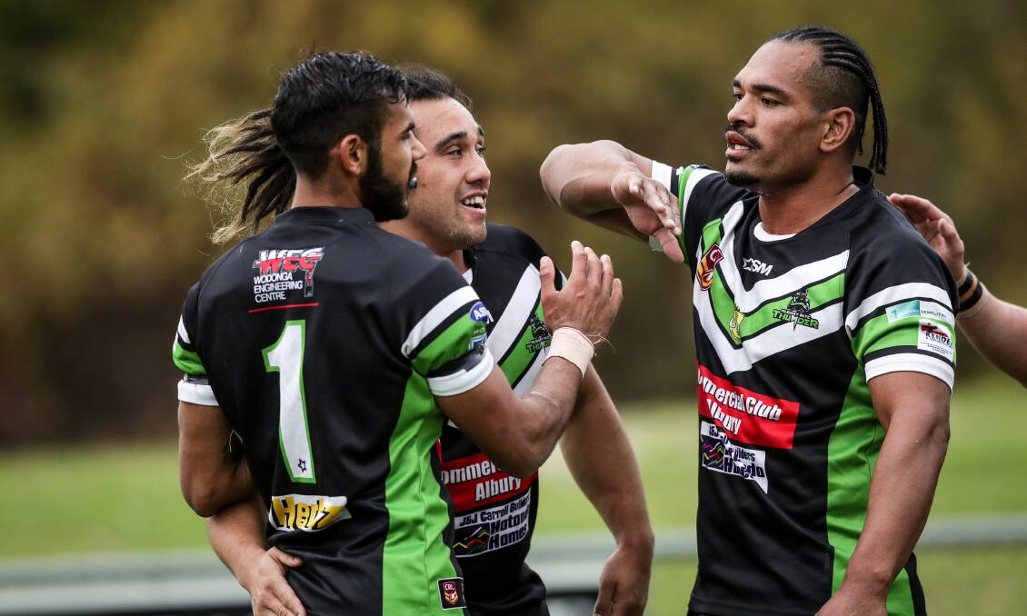 TRY TIME: Keanu Wighton is congratulated by teammates Shannon Rupapere and Etu Uaisele after scoring a try. Picture: JAMES WILTSHIRE