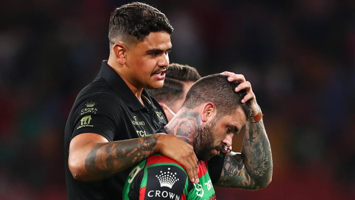 Latrell Mitchell consoles Adam Reynolds after last year's grand final loss to the Panthers. Picture: Getty