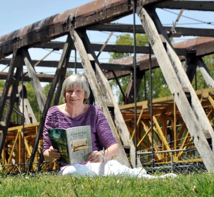 Written in the past: Sherry Morris with one of her published works on the history of Wagga. 