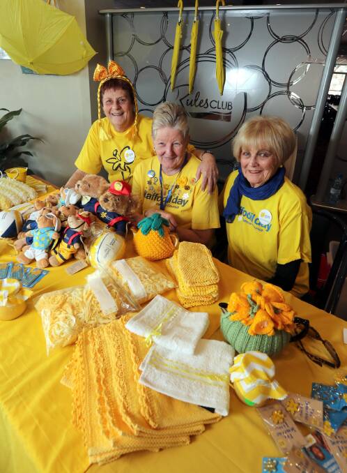 Daffodil Day: Dorothy Ceeney, Carolyn Shawe and Noreen Tuckwell help raise funds for Cancer Council NSW at the Wagga Rules Club.