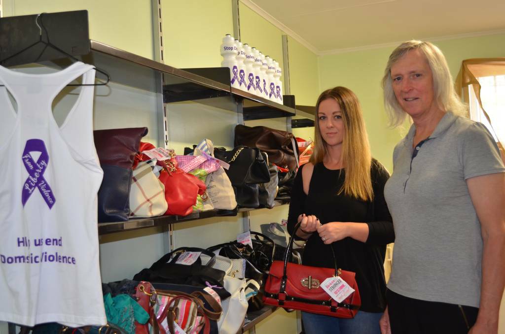 Liberty from Violence founder Jenny Davis (right), with the organisation's warehouse manager, Liza Picciolo, and some of the Share The Dignity handbags in 2017.