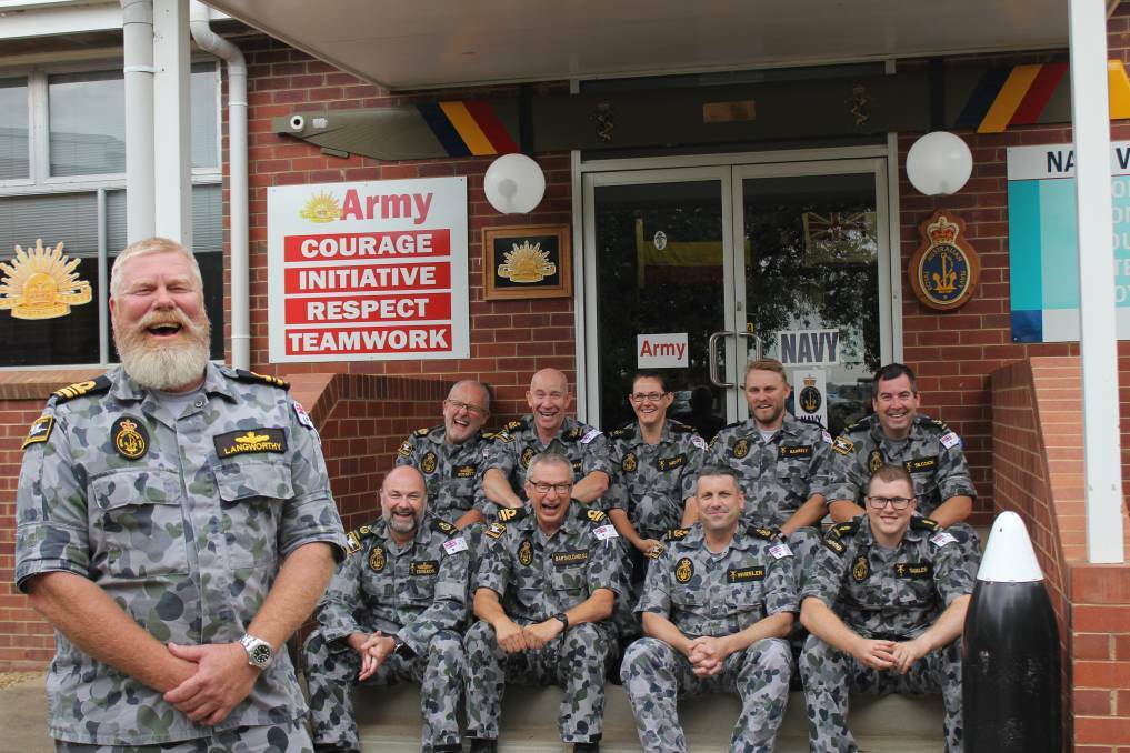 On board: Lieutenant-Commander Wayne Langworthy, with his staff from Wagga's Navy division at RAAF Base Wagga.
