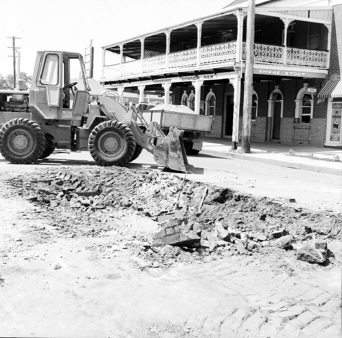Lost but not gone: An archived photo from The Daily Advertiser, reveals the demolition of Wagga's underground toilets on Forsyth Street in 1973. 