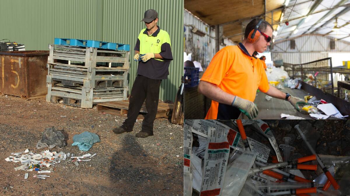 Toxic trash: Tumut-based Gilmore Waste and Recycling Facility site coordinator Chris Campton, with a pile of used syringes and worker Jeffrey Dunn (r) at the conveyor belt in Tumut. Pictures: Supplied 