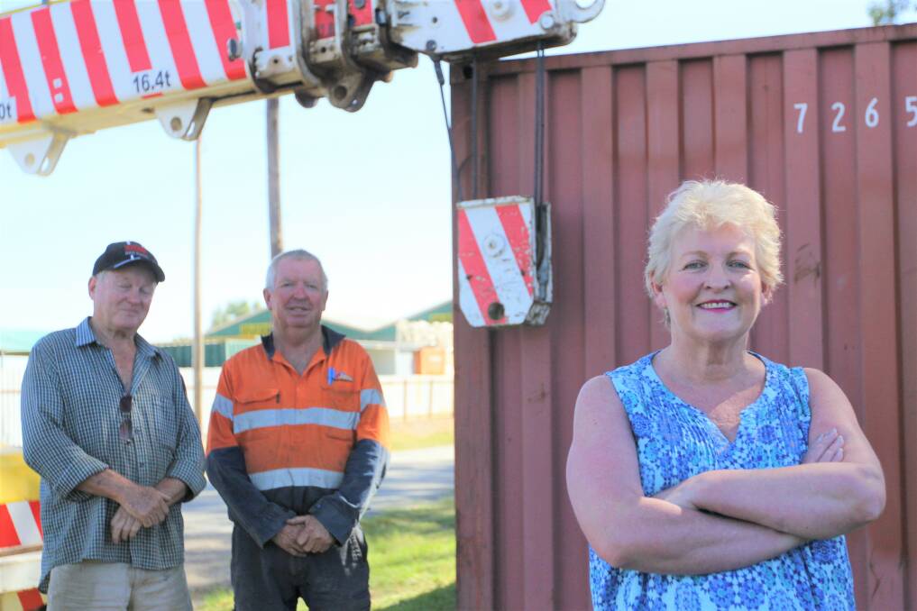 Helping hand: Beryl Wilson has launched an appeal for the Tathra bushfire victims, with Barbeques Galore's Gary Gurtner and Riverina Cranes's Steve Mullins. 