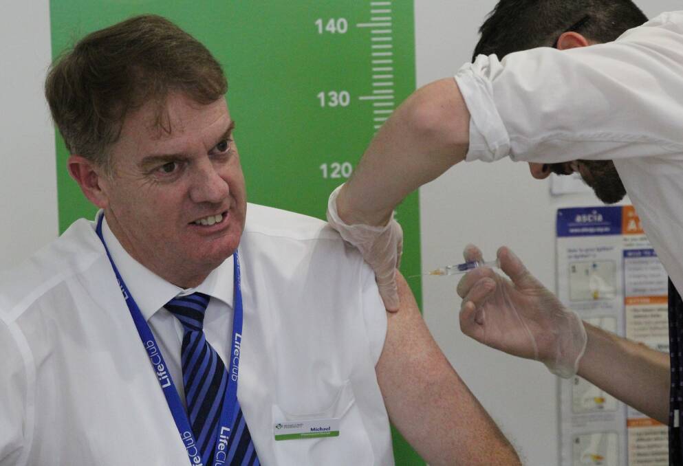 Best defence: Michael O'Reilly from Michael O'Reilly Pharmacy receiving his influenza vaccination, ahead of this year's flu season. 