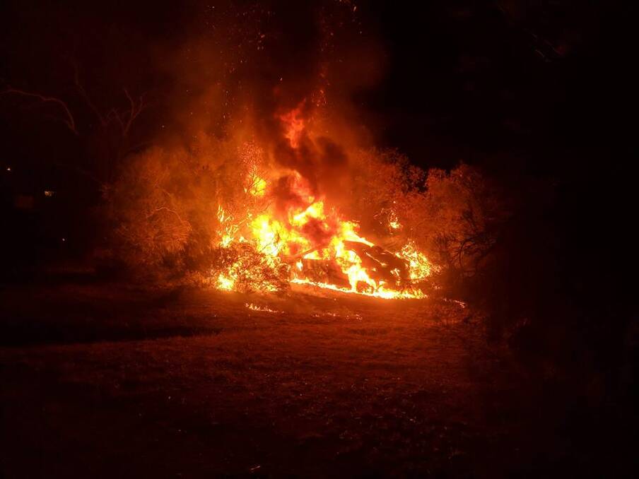 Frustration ignited: Firefighters were battling two fires in Tolland, lit within minutes of each other. Picture: Supplied