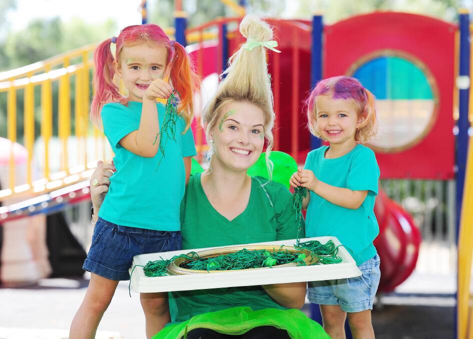 Hair raising happiness: Frankie, 4, and her sister Rio Michel, 2, celebrated all things green with educator Ashlee Collins for Saint Patrick's Day.