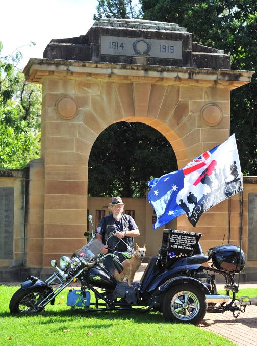 Soldier's soul: Motorcyclist Robert Eade planted an Australian flag in the Victory Memorial Gardens to honour fallen Vietnam War soldier Peter Edward McDuff. 