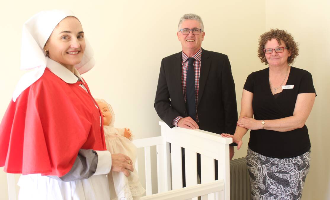 Milestone achievement: clinical nurse consultant for child and family health Jodie Bruce, with Tresillian chief executive Robert Mills and the Wagga branch manager Karen Griffin.