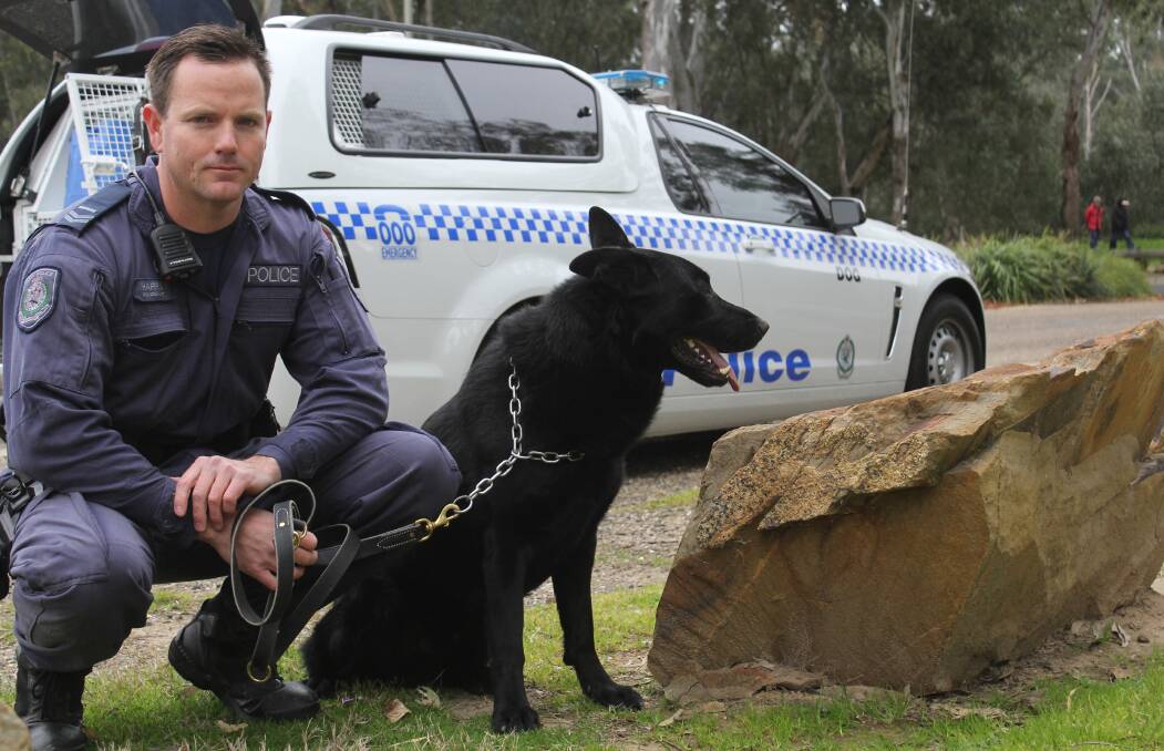 On 'pawtrol': Riverina Dog Unit canine handler Senior Constable Karl Harris, with his new pack-mate Buster, following the purpose-trained doggo's arrival on Monday. 