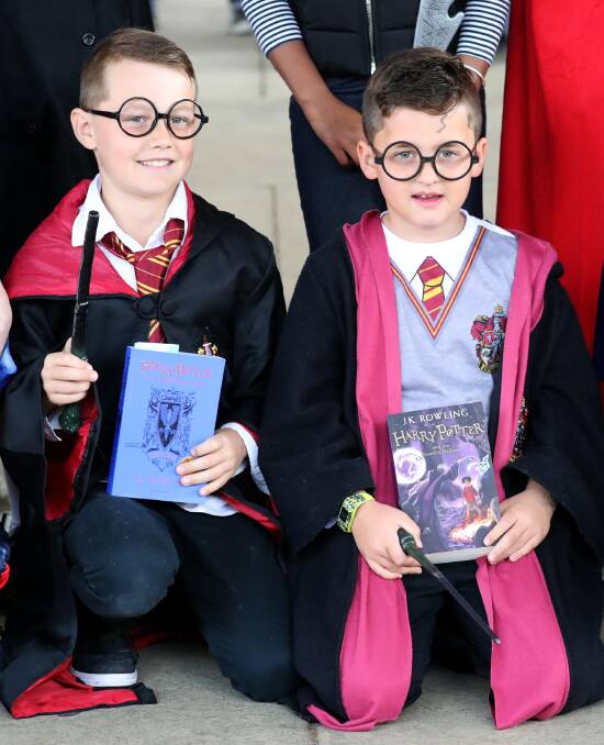 WILD ABOUT HARRY: Kooringal Public School students Kye Howard, 8, and Charlie Matthews, 9, dress up as Harry Potter for Book Week. Picture: Les Smith