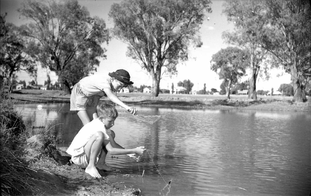 PAST: Keith and Neil Duncan yabbying at North Wagga in December 1960. Contact Wagga and District Historical Society at www.wwdhs.org.au. Picture: Lennon Collection