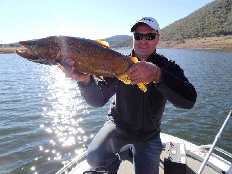 ELUSIVE ONE: Col Robinson with a nice brown trout caught at Eucumbene. Picture: Contributed