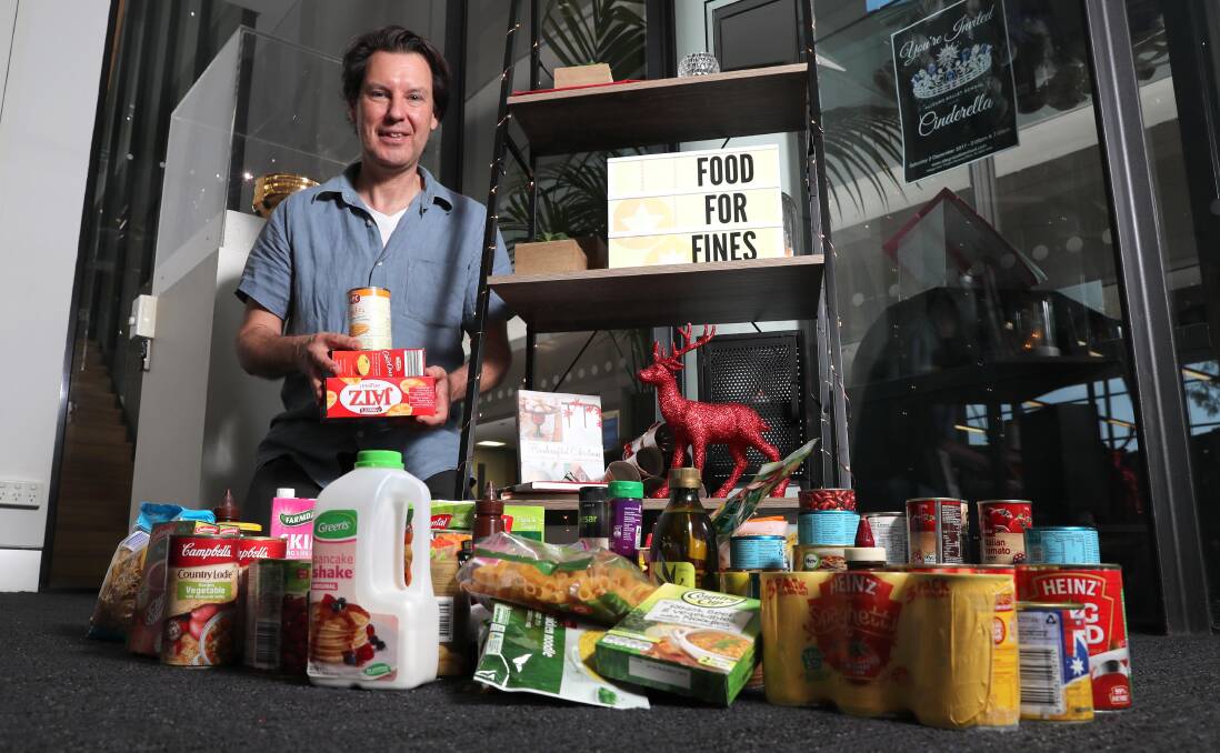 HELP: Peter Casey with last year's donations. Food for Fines helps local families who are experiencing financial difficulties. Donations of lunchbox items would be appreciated.