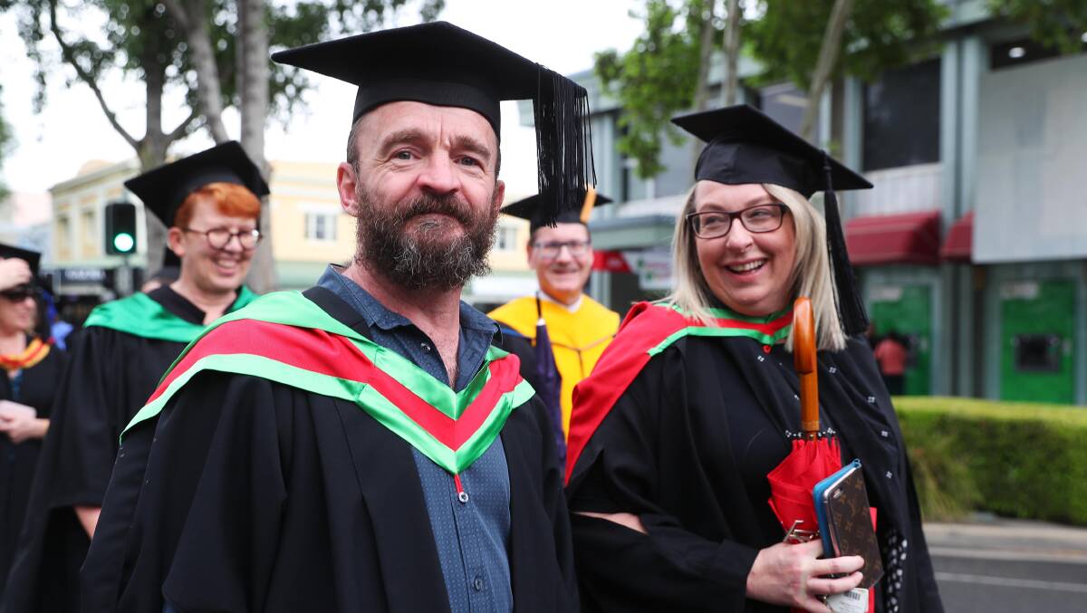 EDUCATION: Daryl South and Kellie Bousfield take part in the Town and Gown procession down Baylis Street earlier this week. Picture: Emma Hillier