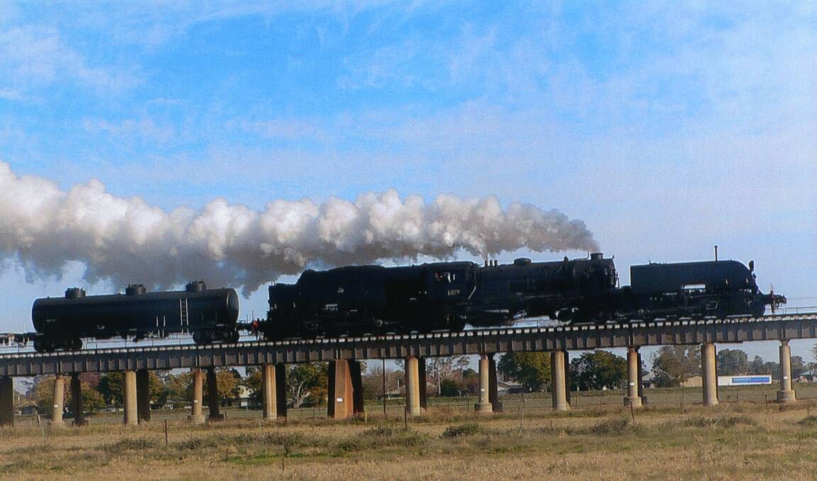 ALL ABOARD: Vintage  Beyer-Garratt 6029 steam locomotive crossing the North Wagga Viaduct in 2015. Contact Wagga Wagga and District Historical Society at www.wwdhs.org.au  or on Facebook at wagga.history. Picture: Geoff Haddon