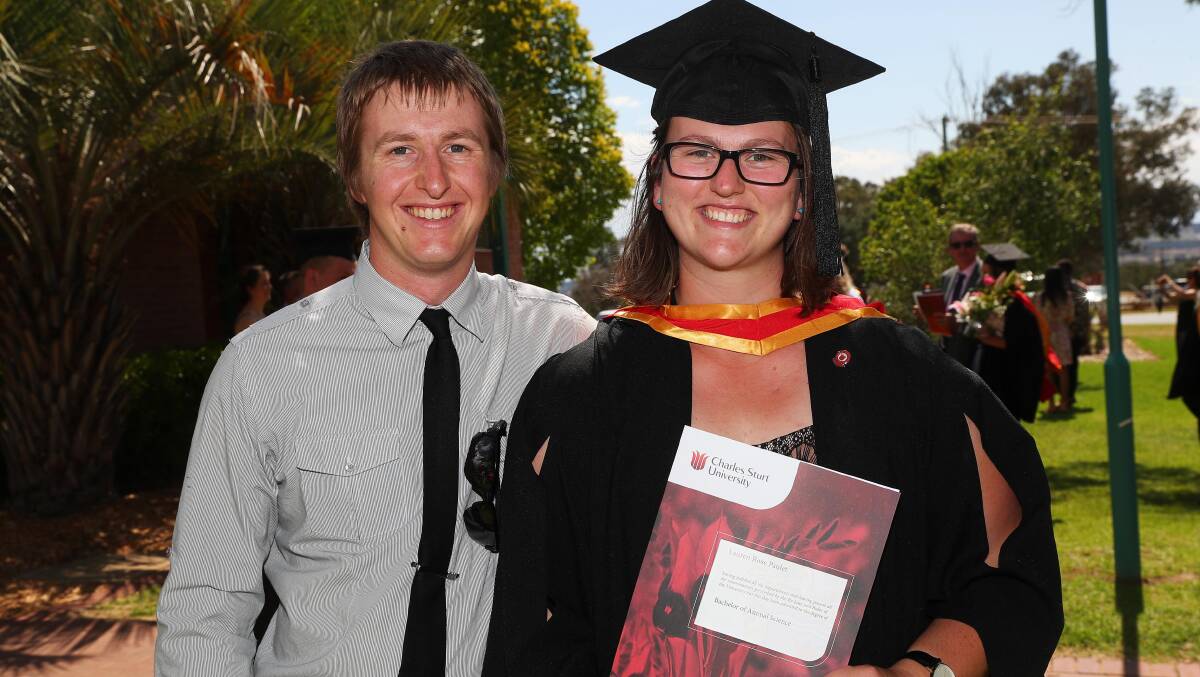 ALL SMILES: John and Lauren Paulet celebrate after the graduation ceremony for the Faculty of Science students.