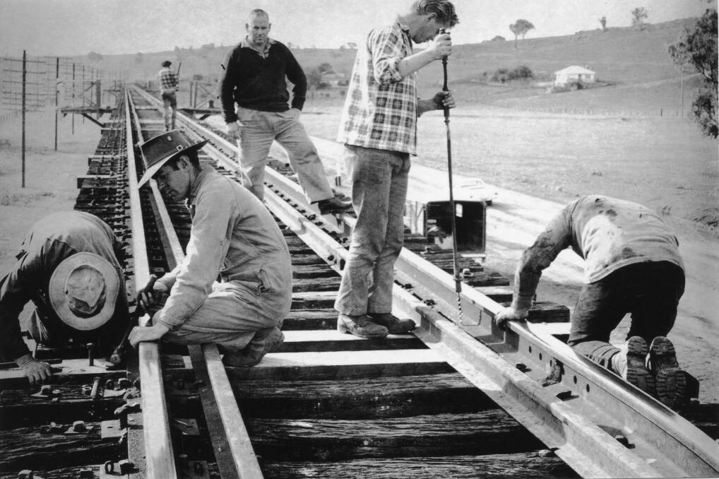 HARD WORK: Rail workers replacing sleepers on the railway viaduct. Contact Wagga Wagga and District Historical Society at www.wwdhs.org.au or on Facebook at wagga.history. Picture: Lennon Collection CSURA