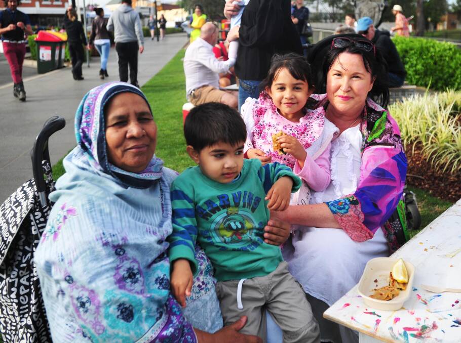COME TOGETHER: Umi, Taha, 3, Talazzul, 5 and Lauren Oakman enjoy a bite to eat at Fusion in Wagga's Victory Memorial Gardens on the weekend. Picture: Chelsea Sutton