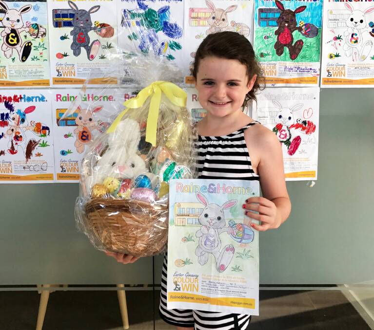 WINNER, WINNER CHOCOLATE DINNER: Abbey Matheson, with her winnings from the Raine&Horne colouring in competition. Picture: Contributed