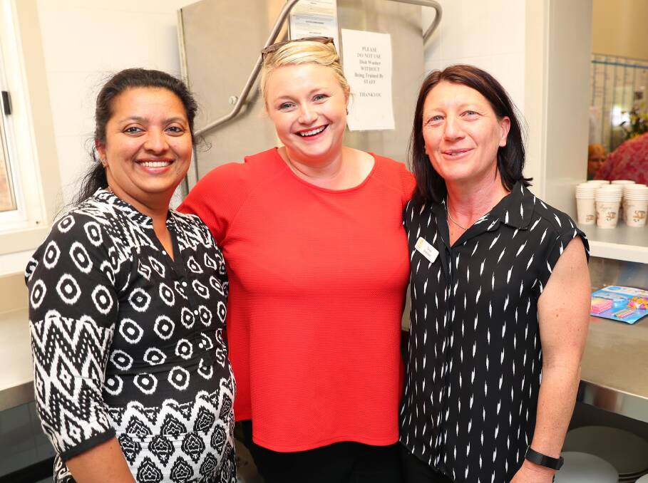 CELEBRATE: Indu Paul, Maja Asmus and Tanya Shephard having a chat in the kitchen at the Sunflower House 10th birthday party. Picture: Kieren L Tilly