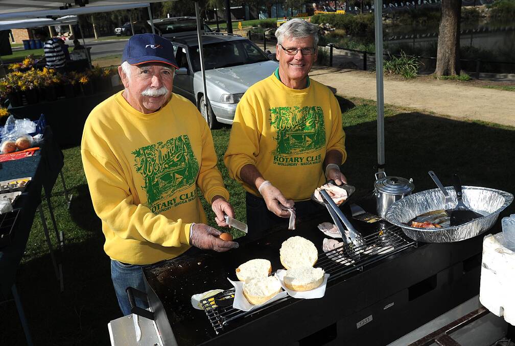 TASTY TREATS: Wollundry Rotary's Pete Crozier and Gerry Gerlach at the Sprout and About markets. Picture: Laura Hardwick