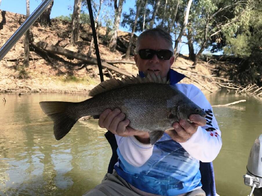 HAPPY FISHER: Doug Charlton with a nice silver perch  from the Murrumbidgee River. Picture: Contributed