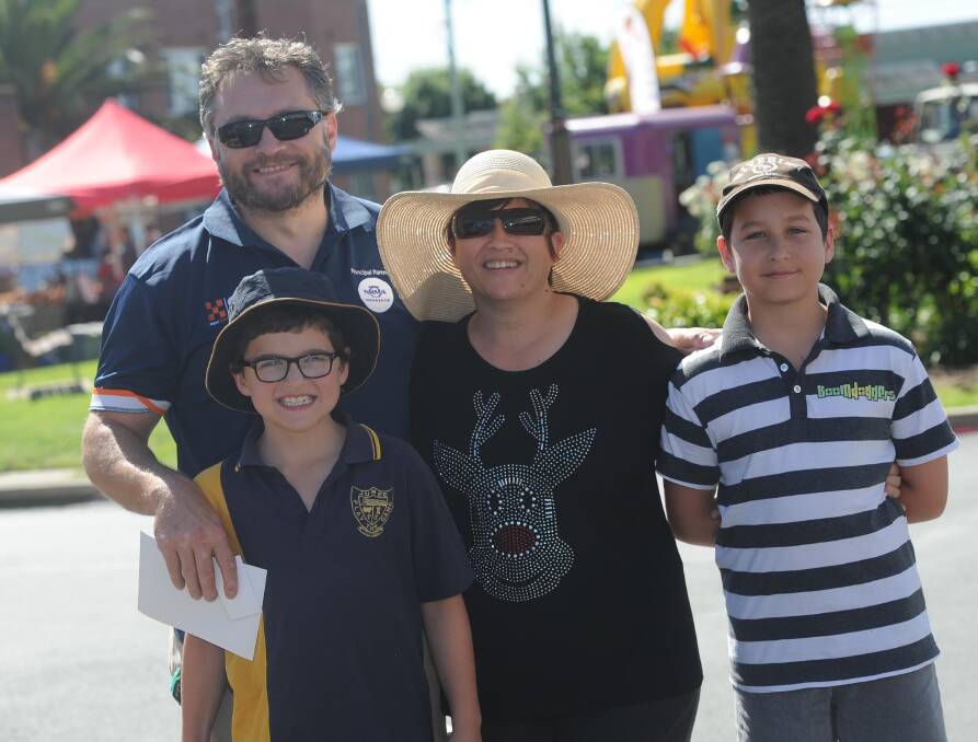 FAMILY TIME: The Muir family - Andrew, Shanon, Lachlan, 11, and (front) Liam, 9, - enjoy their time at the Christmas on Broadway celebrations at Junee at the weekend. Picture: Laura Hardwick