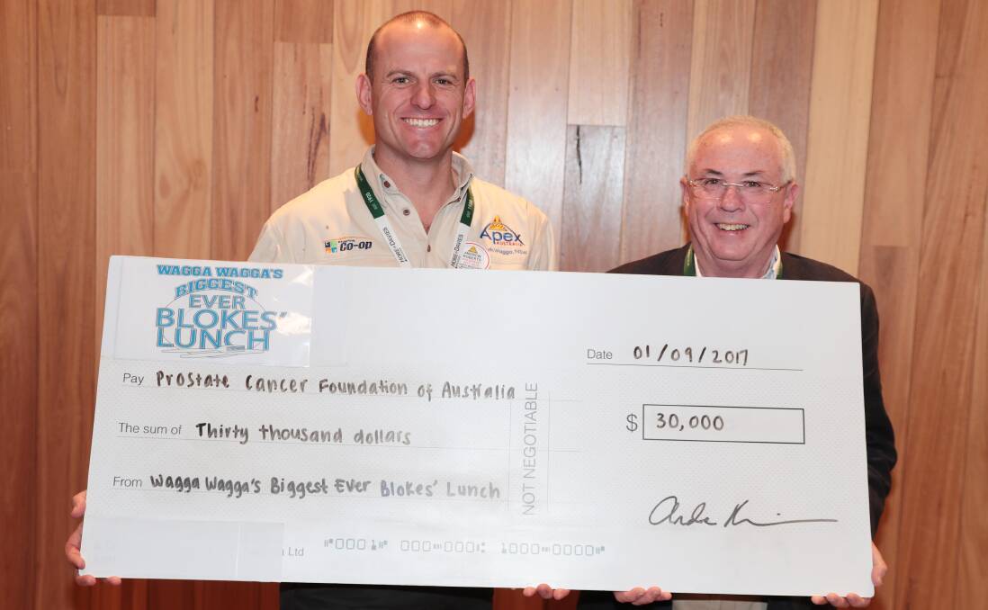 CHEQUE OUT: Blokes Lunch organiser and Apex chairman Andrew Roberts hands a cheque to the Prostate Cancer Foundation of Australia's Jim Hughes.