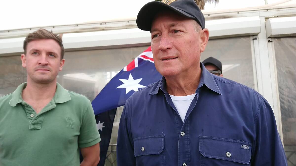 Poor form: Queensland independent senator Fraser Anning (right) at the anti-immigrant rally in St Kilda.