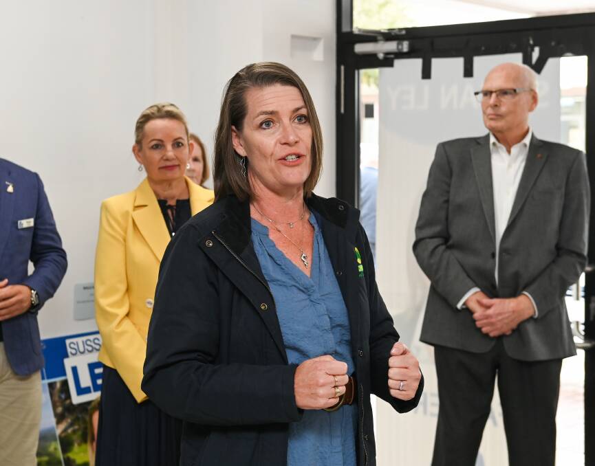 Two at the top: Perin Davey speaks at Sussan Ley's recent election campaign launch in Albury as the member for Farrer and Liberal senator Jim Molan watch on. Picture: MARK JESSER