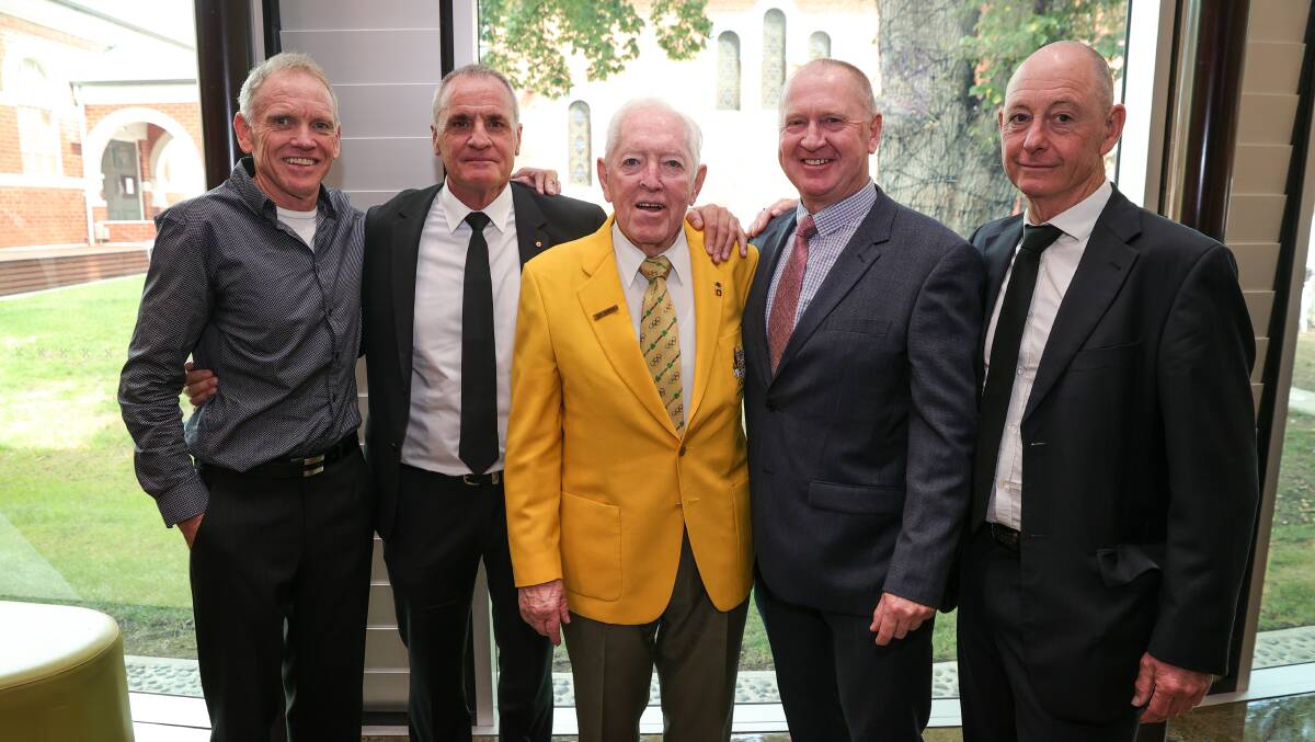 Special tie: Woods' 1984 Olympic team-mates Glenn Clarke, Michael Turtur, Michael Grenda and Kevin Nichols join their manager Ray Godkin (centre) after the funeral.