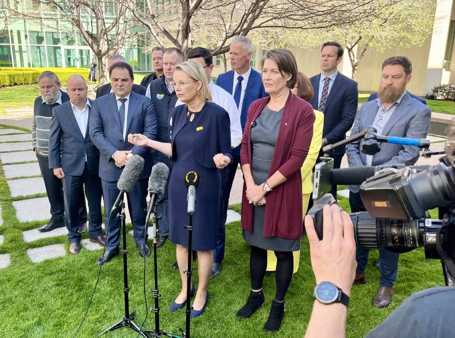 Sussan Ley speaks to the media at Parliament House in Canberra while flanked by fellow Coalition MPs and beneficiaries of the irrigation network. Picture supplied