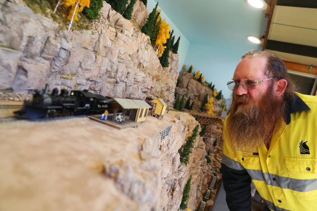 TRAIN ENTHUSIASTS: Garry Edgar's layout of a model railway is called 'Bobcat County'. Picture: Emma Hillier