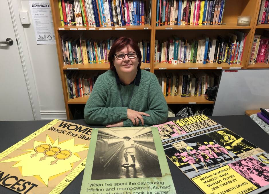 LOOKING BACK: Julie Mecham with posters from the last four decades. Picture: Les Smith