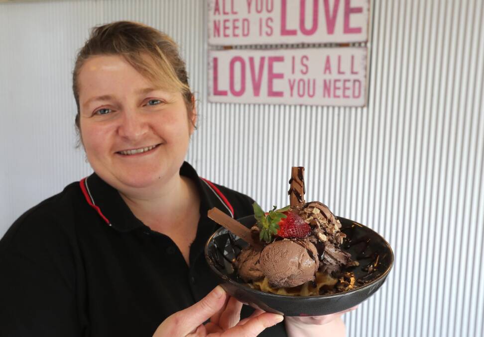 CHOCOLATE TREAT:  Kylie Bean with her waffle creation that has one secret ingredient. The waffles are a 'social media favourite'. Picture: Les Smith 