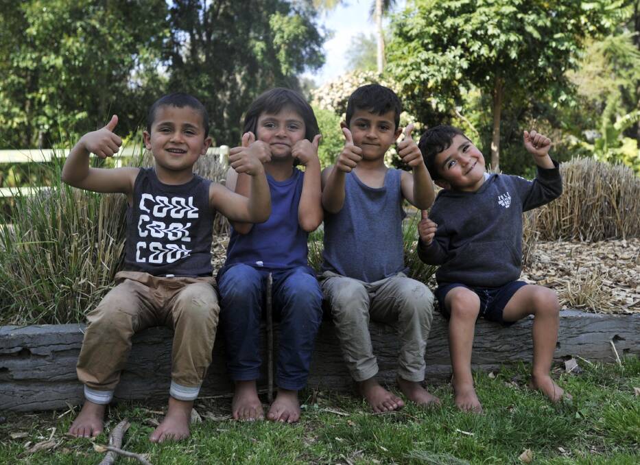 SCHOOL HOLIDAYS: Ayhan, 7, Ayham, 6, Ayhab, 5 and Ayad Hussaen, 4, enjoy the spring weather at the Botanic Gardens. Picture: Chelsea Sutton 