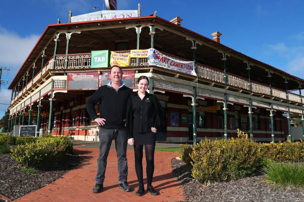 WATERING HOLE: Danny Milne and Caitlin Garrett out the front of the New Coolamon Hotel. 