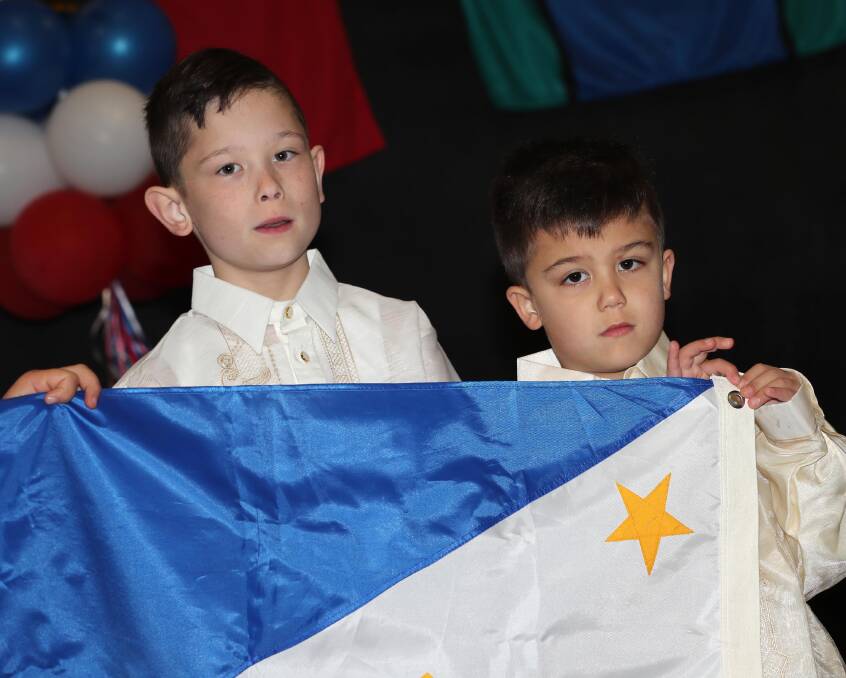 PROUD: Nick O'Donnell, 9, with his brother Jayden O'Donnell, 6, singing the Australian national anthem. Picture: Les Smith 
