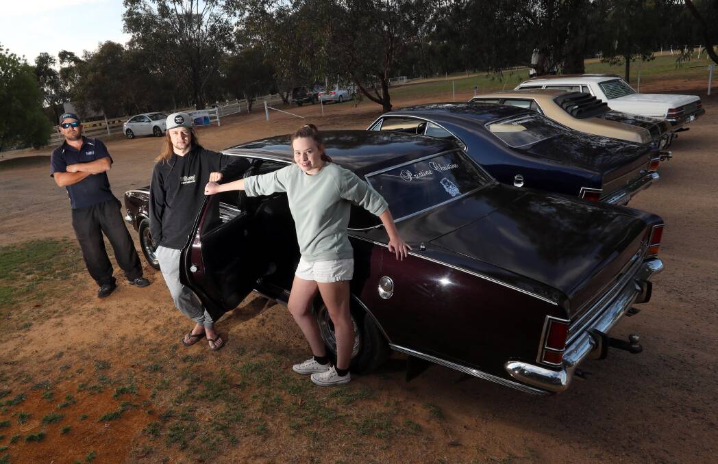 Jason Baxter with his daughter 16 yo Emily Baxter and Aaron Eyres and Jason's 1970 Brougham HG. 

